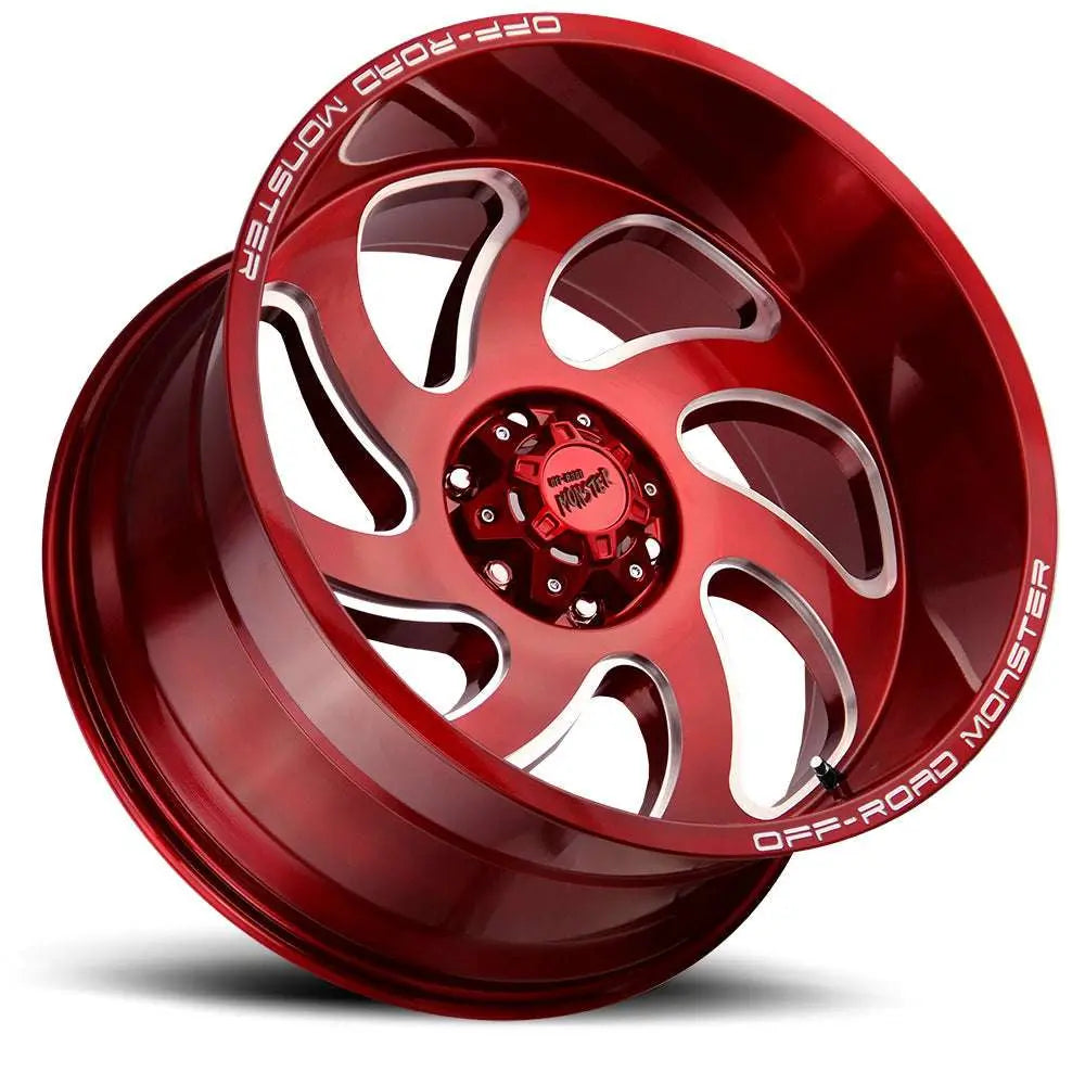 Off Road Monster candy red off road wheels with bold cutout design and branded center cap